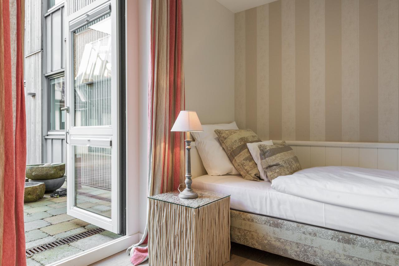 Apartmenthotel Am Leuchtturm Hornum Bagian luar foto