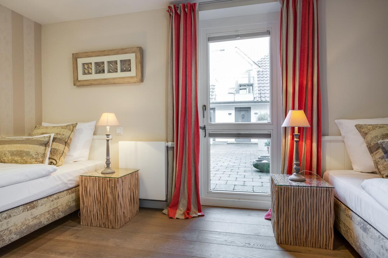 Apartmenthotel Am Leuchtturm Hornum Bagian luar foto
