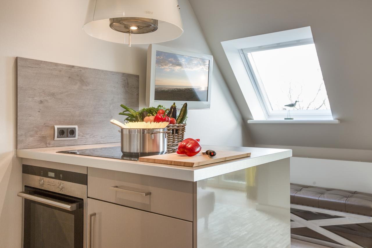Apartmenthotel Am Leuchtturm Hornum Bagian luar foto